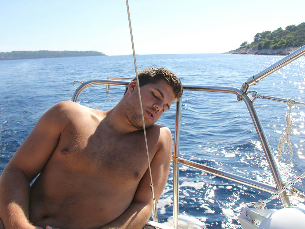 People enjoy day on a sailboat